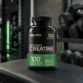 Optimum Nutrition Creatine Capsules bottle on gym bench