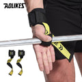Yellow lifting strap secured on barbell for deadlift grip